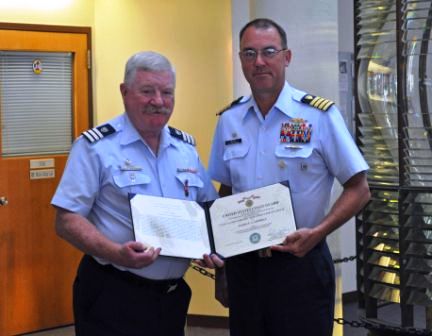 Auxiliarist Campbell receiving award from CAPT Milne