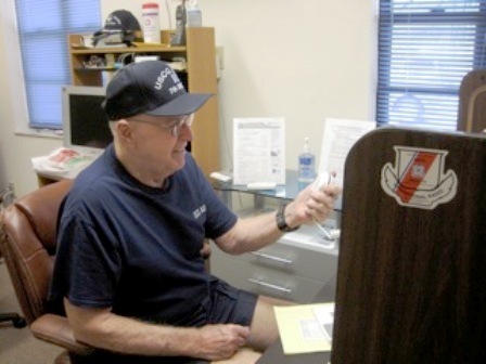 Vince Whalen standing watch at Coast Guard Auxiliary Stuart Radio