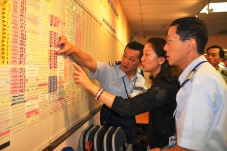 Auxiliary Chinese interpreters, Steven Wang (left) and Jimmin Chang (right) explained how T cards worked in Incident Command System.