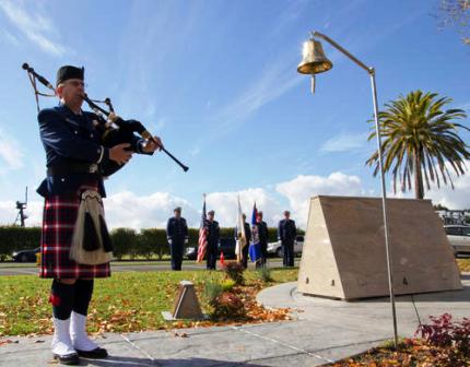 Bagpiper plays at memorial