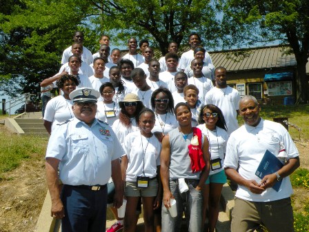 Flotilla 18-7 Commander, Jay Garcia (left), stands with the students and counselors who attended 