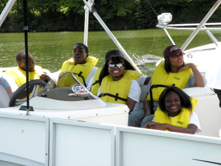 Students attending the Summer Transportation Institute enjoy a boat ride during Coast Guard Day. For many of them it was their first time on the water